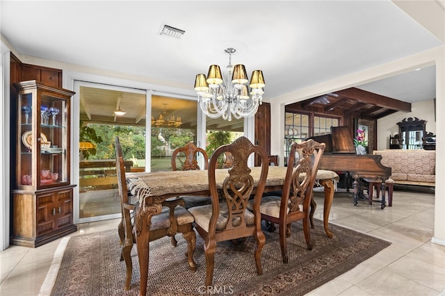 dining space with a notable chandelier and light tile patterned flooring