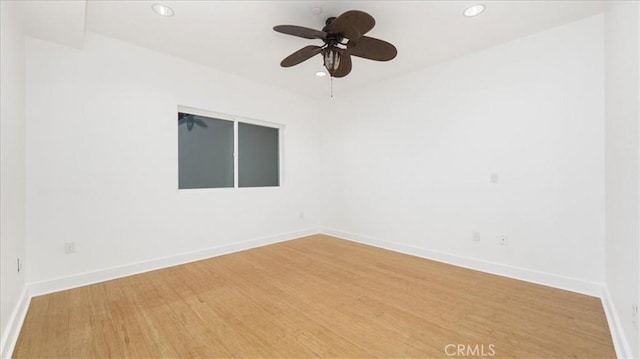 empty room featuring ceiling fan and wood-type flooring