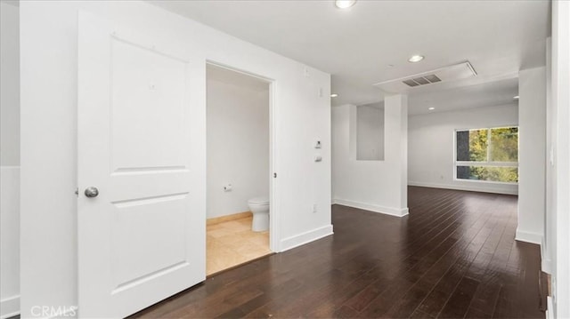 empty room with dark wood-type flooring