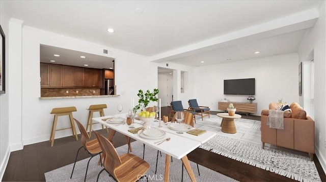 dining area with wood-type flooring