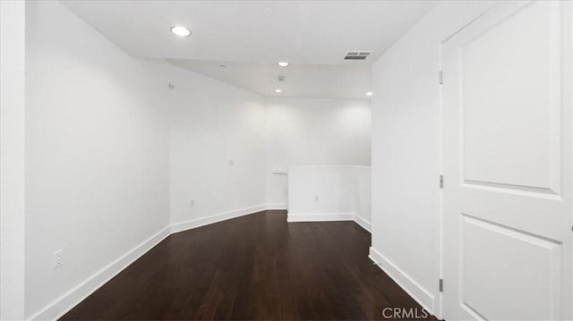 unfurnished room featuring dark hardwood / wood-style flooring