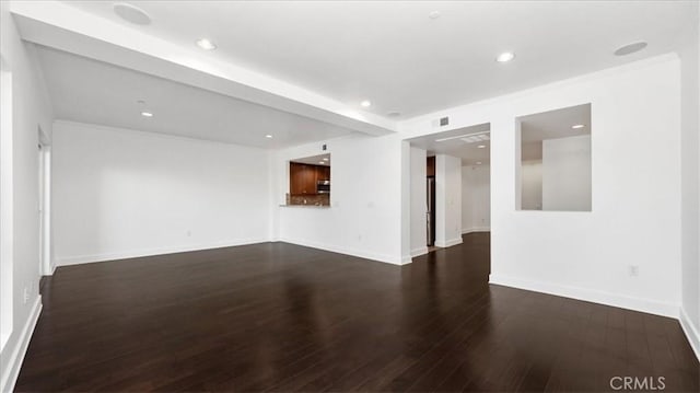 empty room with dark hardwood / wood-style floors