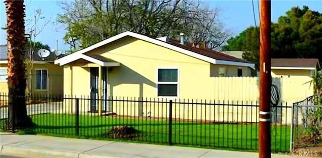 view of side of property with a yard