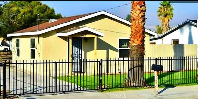 view of gate featuring a lawn