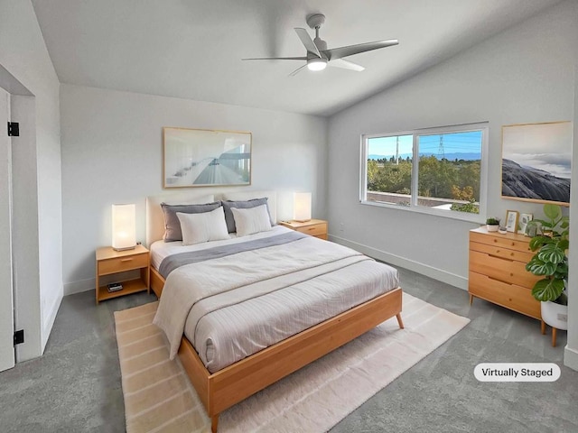 bedroom featuring lofted ceiling, dark colored carpet, and ceiling fan