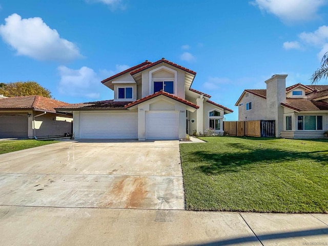 mediterranean / spanish-style house featuring a front yard and a garage