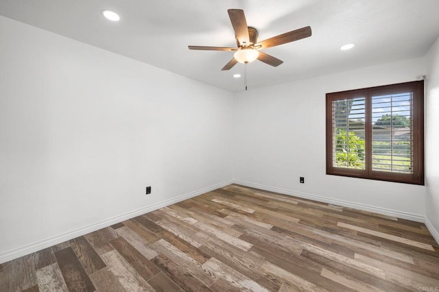 unfurnished room with hardwood / wood-style flooring and ceiling fan