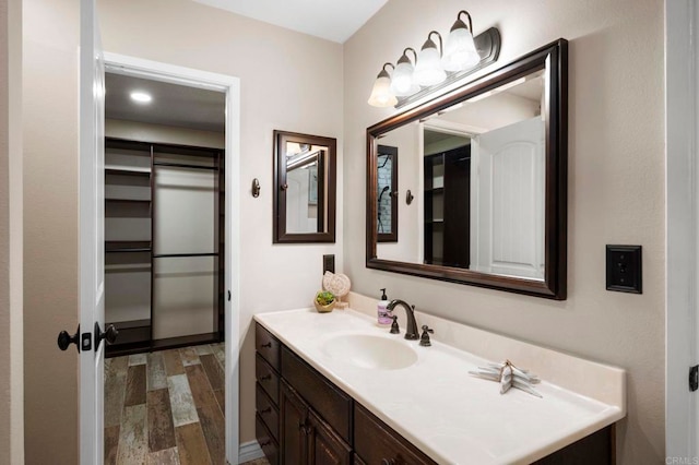 bathroom with vanity and wood-type flooring