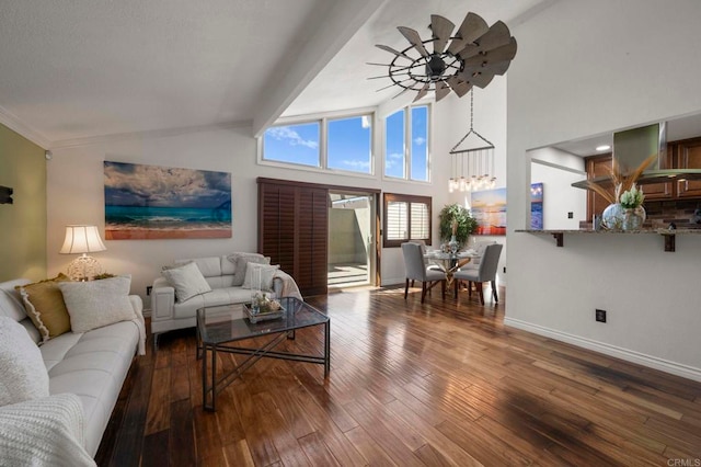 living room with ceiling fan, beamed ceiling, a towering ceiling, and wood-type flooring