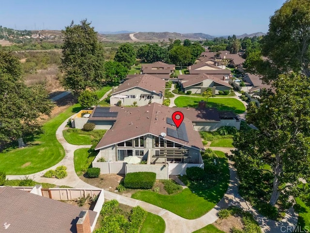 birds eye view of property featuring a mountain view