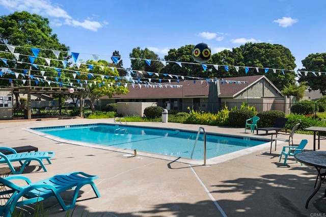 view of swimming pool featuring a pergola and a patio area