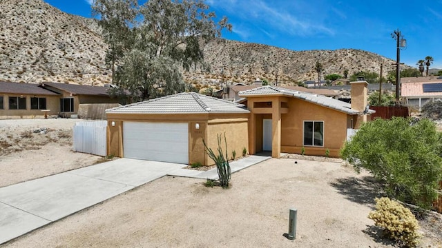 view of front of home with a mountain view