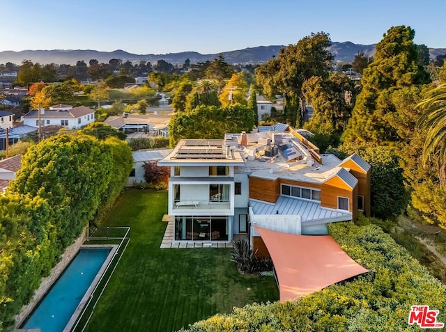 birds eye view of property with a mountain view