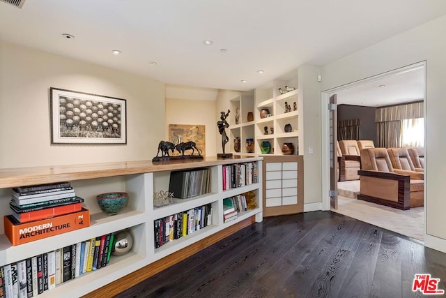 living area with dark hardwood / wood-style floors