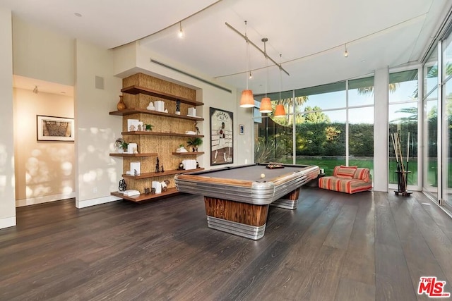 recreation room featuring expansive windows, dark hardwood / wood-style flooring, rail lighting, and pool table