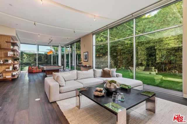 sunroom / solarium featuring rail lighting and pool table