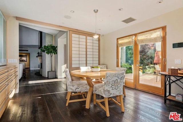 dining room with dark hardwood / wood-style floors