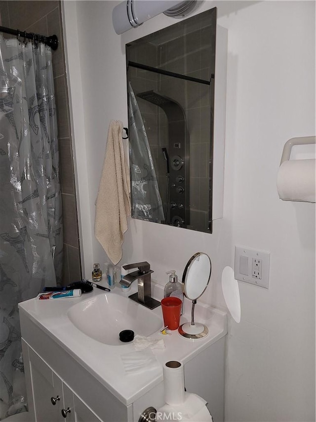 bathroom featuring vanity and walk in shower