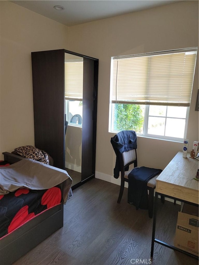 bedroom featuring dark hardwood / wood-style floors