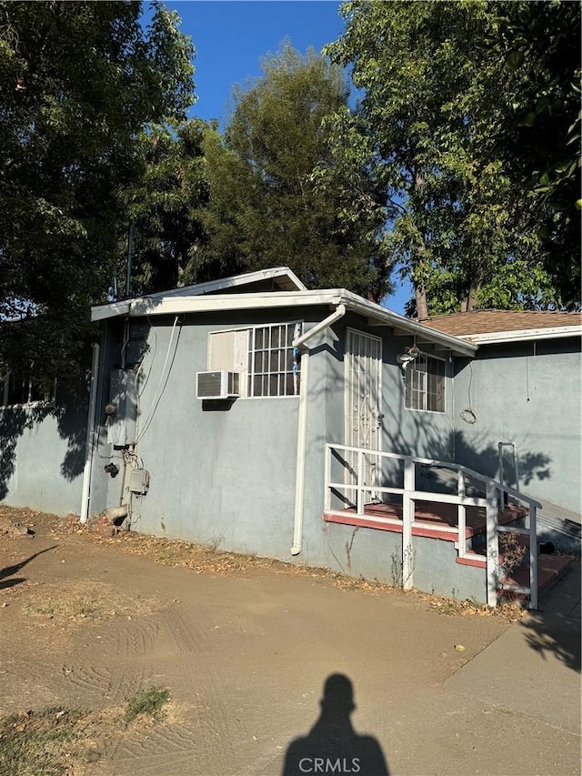 view of side of home with cooling unit