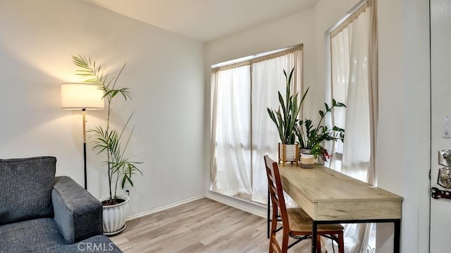 office area with light hardwood / wood-style floors