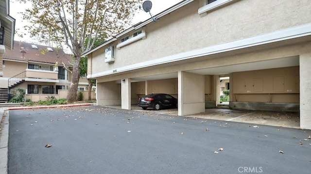 view of parking with a carport