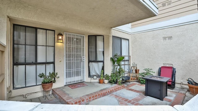 property entrance with a patio