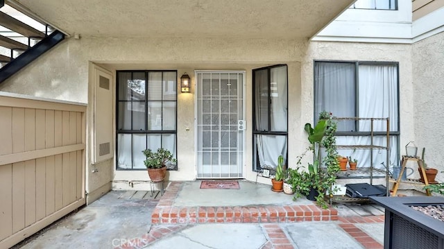 entrance to property with a patio area