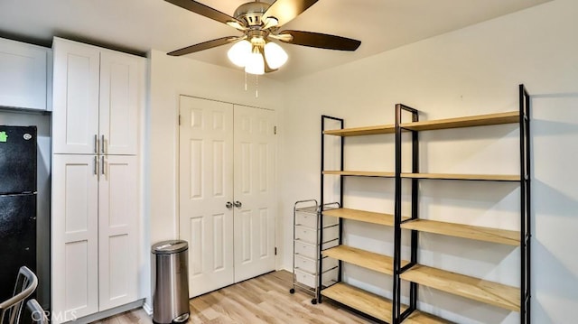 interior space with ceiling fan