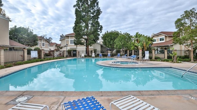 view of pool with a community hot tub