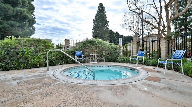 view of pool featuring a hot tub