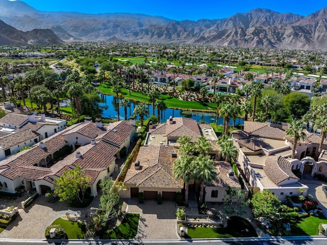 birds eye view of property featuring a water and mountain view