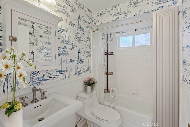 full bathroom featuring toilet, sink, and shower / tub combo