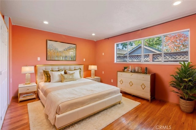 bedroom with light hardwood / wood-style flooring