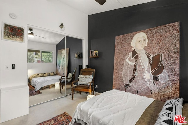 bedroom with ceiling fan and a closet