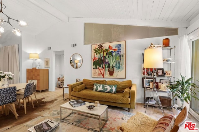 living room with vaulted ceiling with beams, light hardwood / wood-style flooring, and wooden ceiling