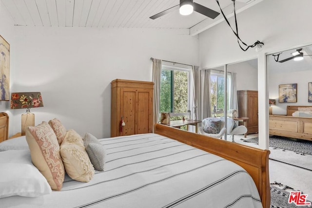 bedroom with wood ceiling, ceiling fan, carpet flooring, and lofted ceiling with beams