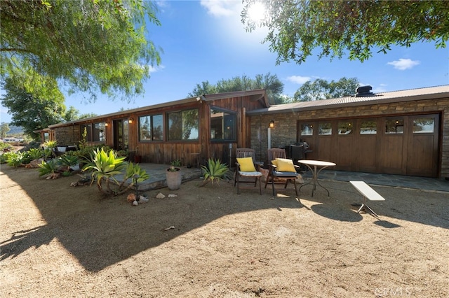 back of house featuring a patio area