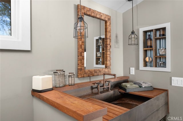 interior space featuring hanging light fixtures and sink