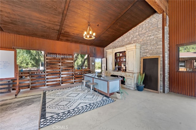 unfurnished living room with a healthy amount of sunlight and wood ceiling