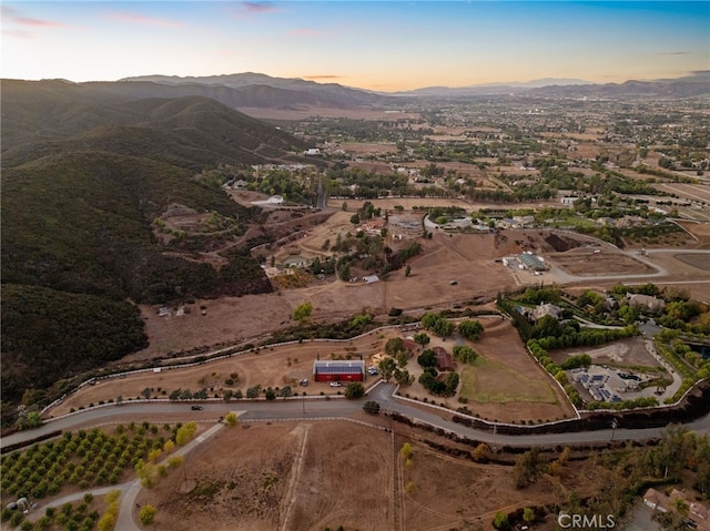 aerial view at dusk with a mountain view