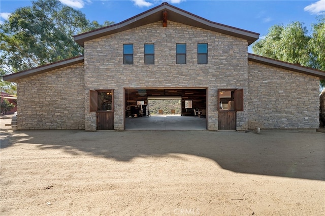 view of home's exterior with cooling unit and a garage