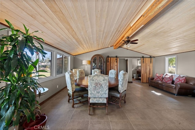 dining room with a barn door, a wealth of natural light, wooden ceiling, and vaulted ceiling with beams