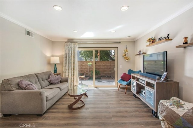 living room featuring crown molding and hardwood / wood-style floors