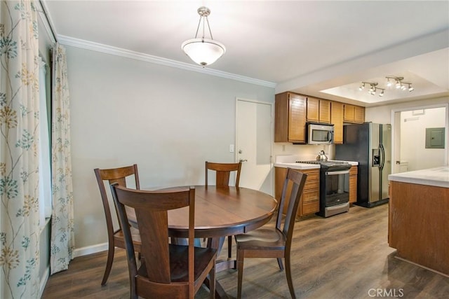 dining room with electric panel, crown molding, and dark hardwood / wood-style flooring