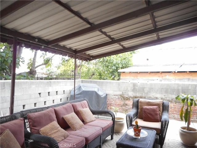 view of patio with grilling area and outdoor lounge area