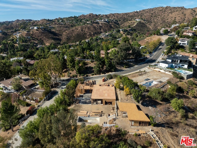 birds eye view of property featuring a mountain view