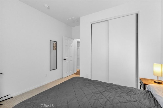 unfurnished bedroom with dark colored carpet and a closet