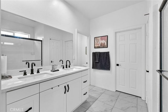 bathroom with vanity and an enclosed shower