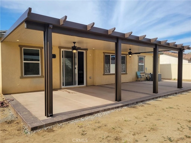 rear view of property with a patio and cooling unit